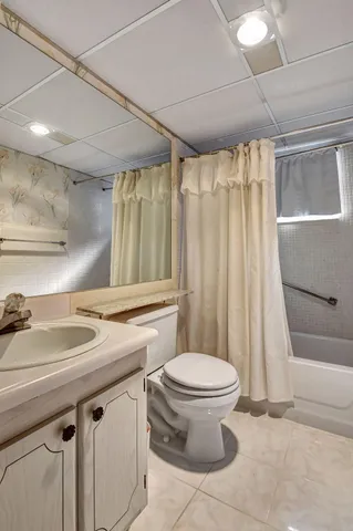 a bedroom with a bed and windows