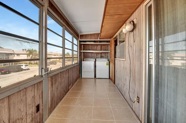 an aerial view of a house with garden space and outdoor seating