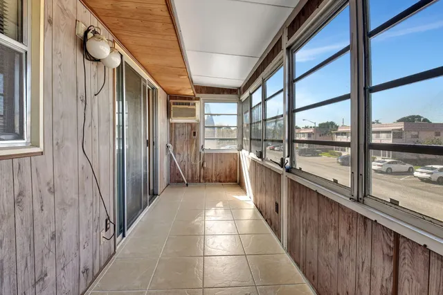 an aerial view of a pool patio chairs and fire pit