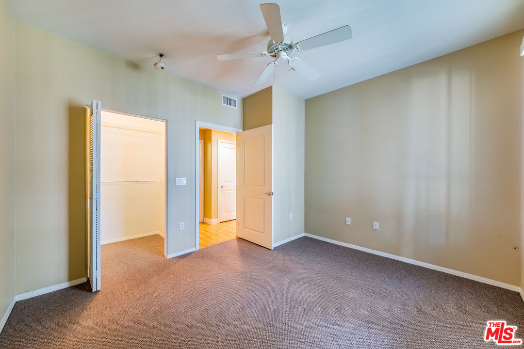 100 South Alameda Street, Unit 154 Los Angeles, CA 90012 - Photo 14 of 25 a view of an empty room and a ceiling fan window