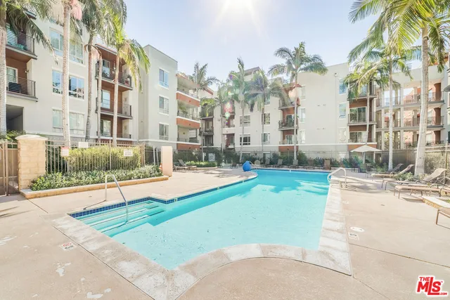 a view of a swimming pool with a lounge chairs