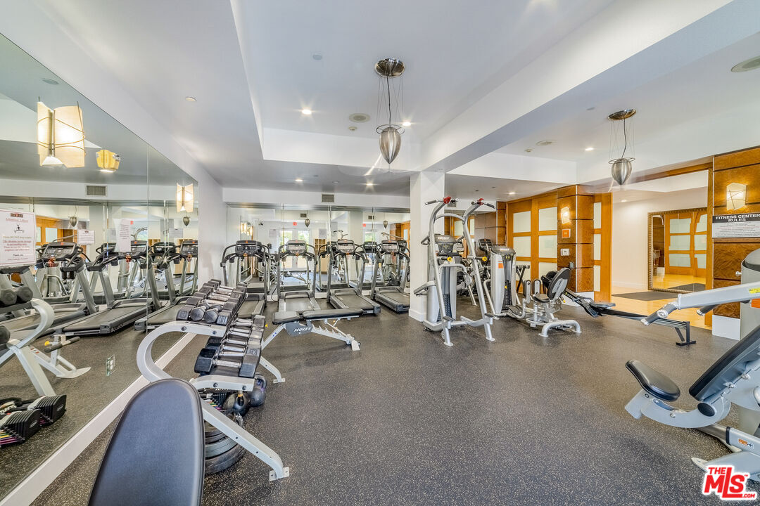 100 South Alameda Street, Unit 154 Los Angeles, CA 90012 - Photo 23 of 25 a view of a room with gym equipment