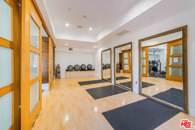 a lobby with furniture and floor to ceiling window