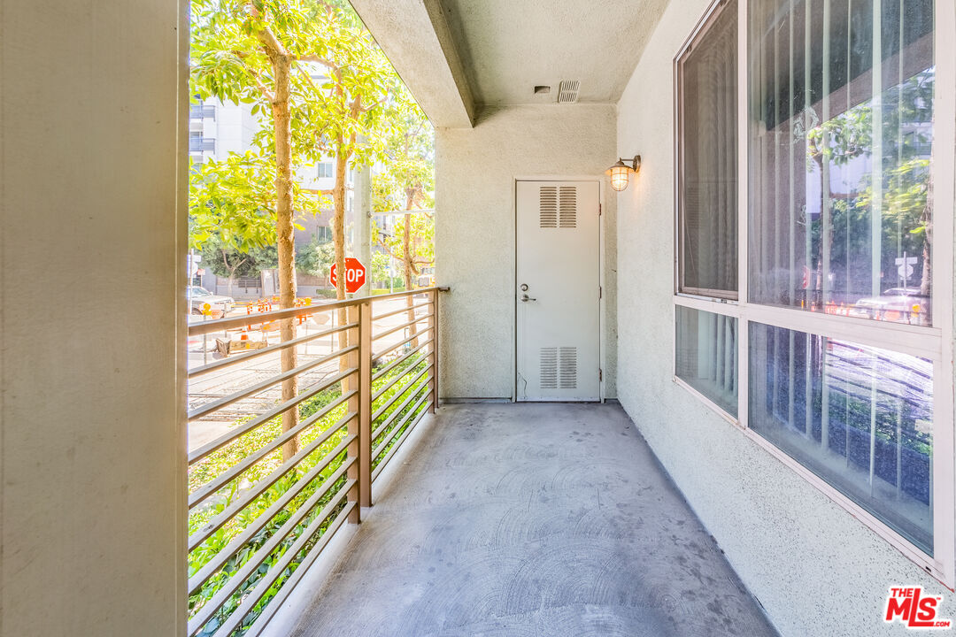 100 South Alameda Street, Unit 154 Los Angeles, CA 90012 - Photo 9 of 25 a view of hallway with windows