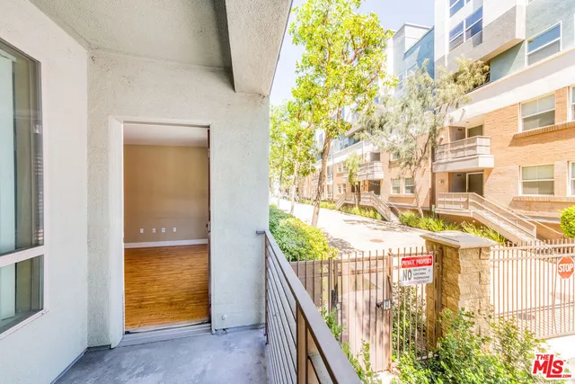 a view of a balcony with an outdoor space