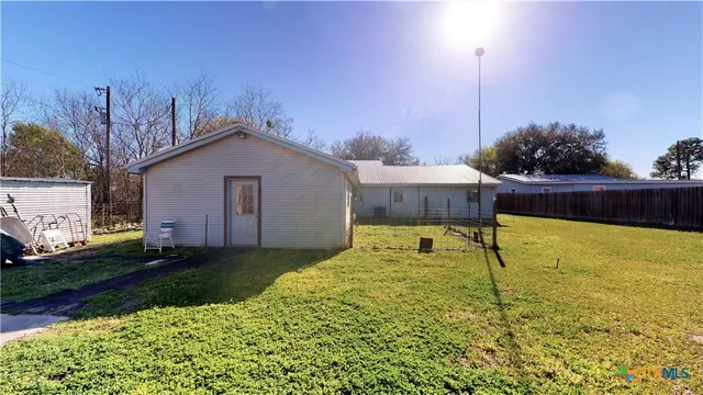 a view of a back yard of the house