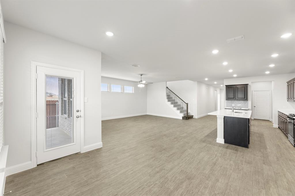 125 Meadow Road Balch Springs, TX 75181 - Photo 11 of 27 a view of a livingroom with a kitchen space and a window