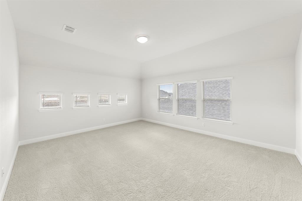 125 Meadow Road Balch Springs, TX 75181 - Photo 12 of 27 an empty room with windows