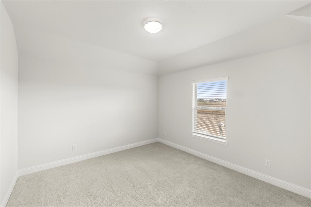 125 Meadow Road Balch Springs, TX 75181 - Photo 13 of 27 an empty room with a window