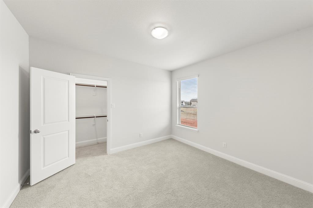 125 Meadow Road Balch Springs, TX 75181 - Photo 14 of 27 wooden floor in an empty room