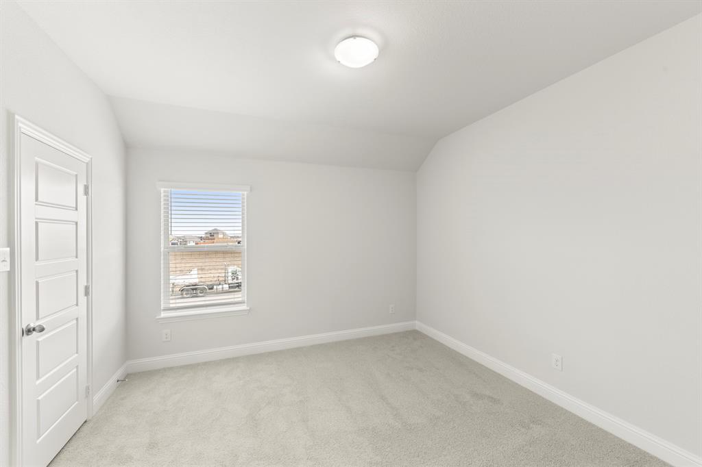 125 Meadow Road Balch Springs, TX 75181 - Photo 15 of 27 an empty room with windows