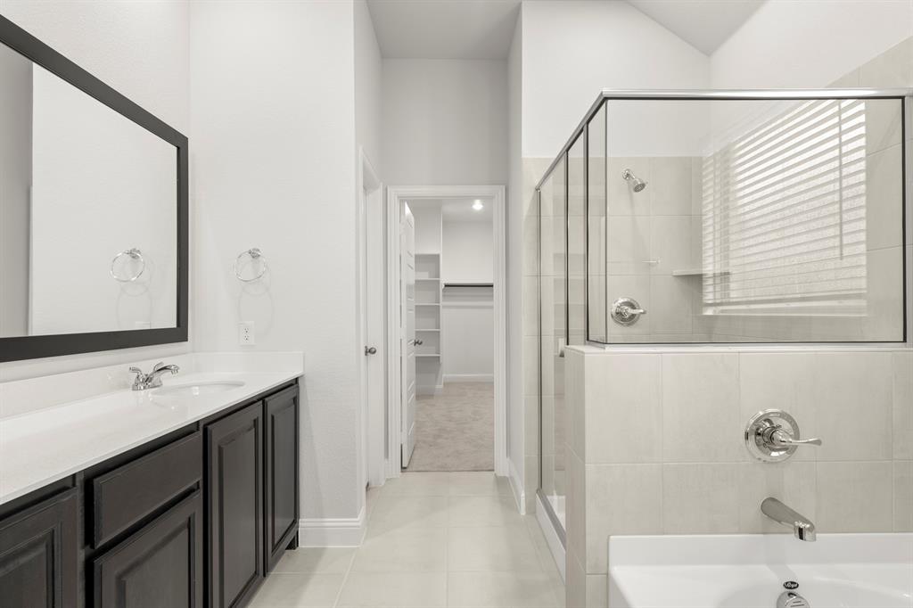 125 Meadow Road Balch Springs, TX 75181 - Photo 20 of 27 a bathroom with a tub sink and mirror