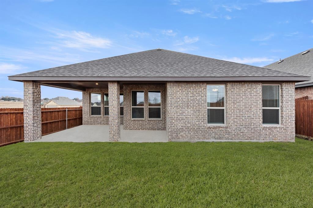 125 Meadow Road Balch Springs, TX 75181 - Photo 26 of 27 a house view with a garden space