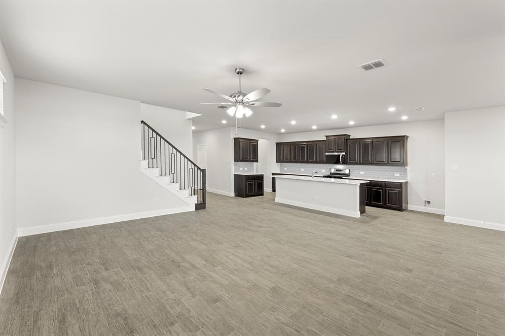 125 Meadow Road Balch Springs, TX 75181 - Photo 6 of 27 a view of a kitchen with a sink cabinets and a kitchen