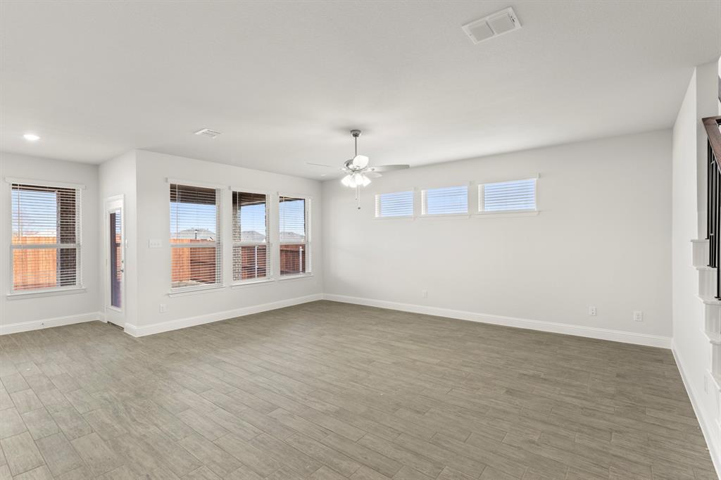 125 Meadow Road Balch Springs, TX 75181 - Photo 9 of 27 a view of an empty room with a window