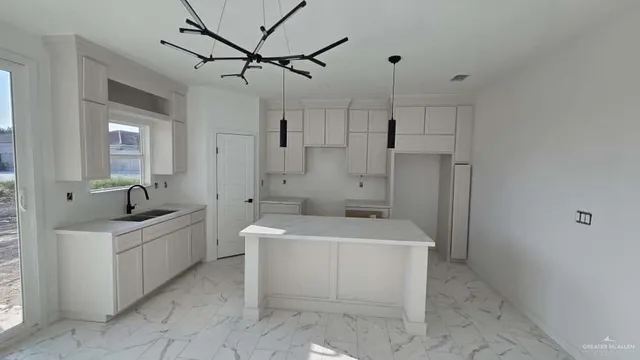 a spacious bathroom with a sink a toilet a mirror and bathtub