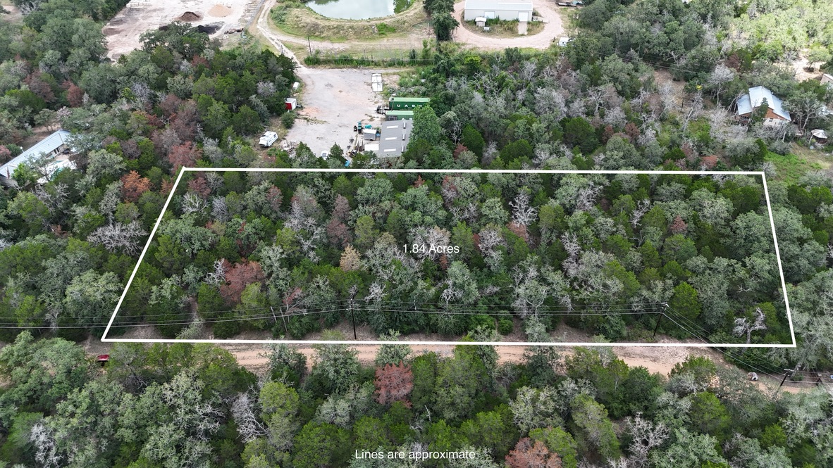 Tbd Red Fox Lane Bastrop, TX 78602 - Photo 1 of 14 A verdant, 1.84-acre lot offers ample space for building a dream home amidst natural beauty.