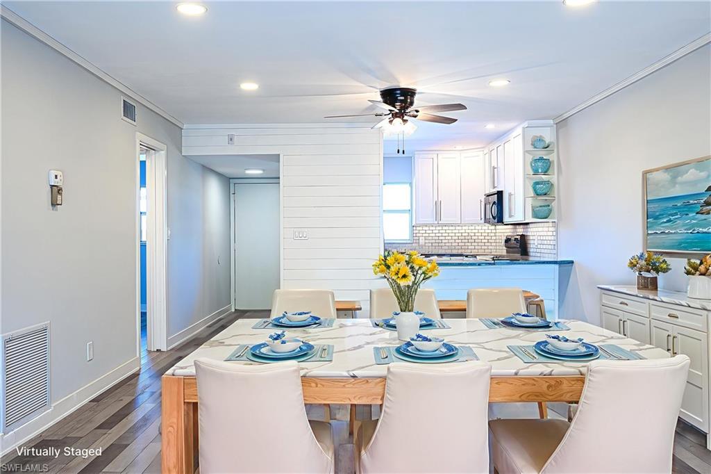 a view of a dining room and kitchen island
