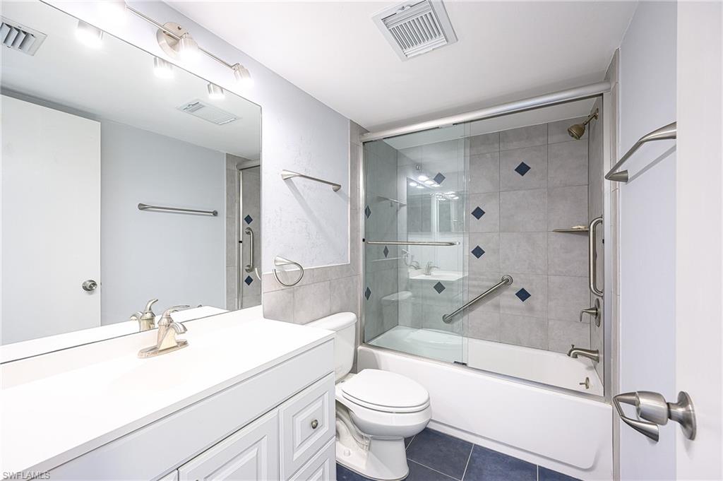 5499 Rattlesnake Hammock Road, Unit 304A Naples, FL 34113 - Photo 24 of 38 a bathroom with a sink a toilet and shower