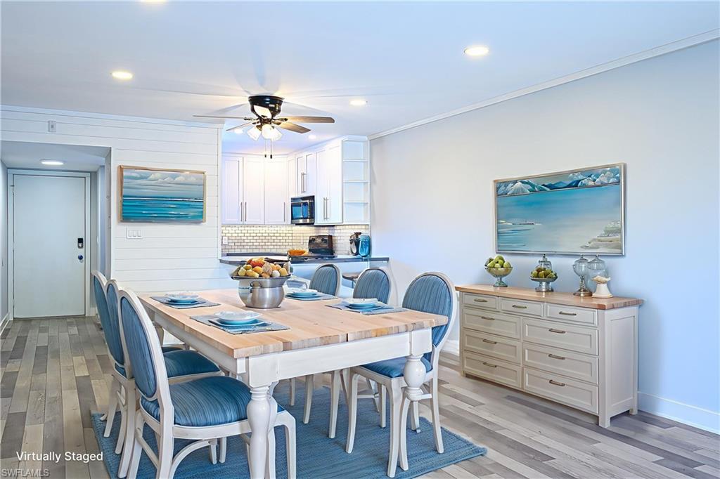 5499 Rattlesnake Hammock Road, Unit 304A Naples, FL 34113 - Photo 4 of 38 a dining room with furniture and window