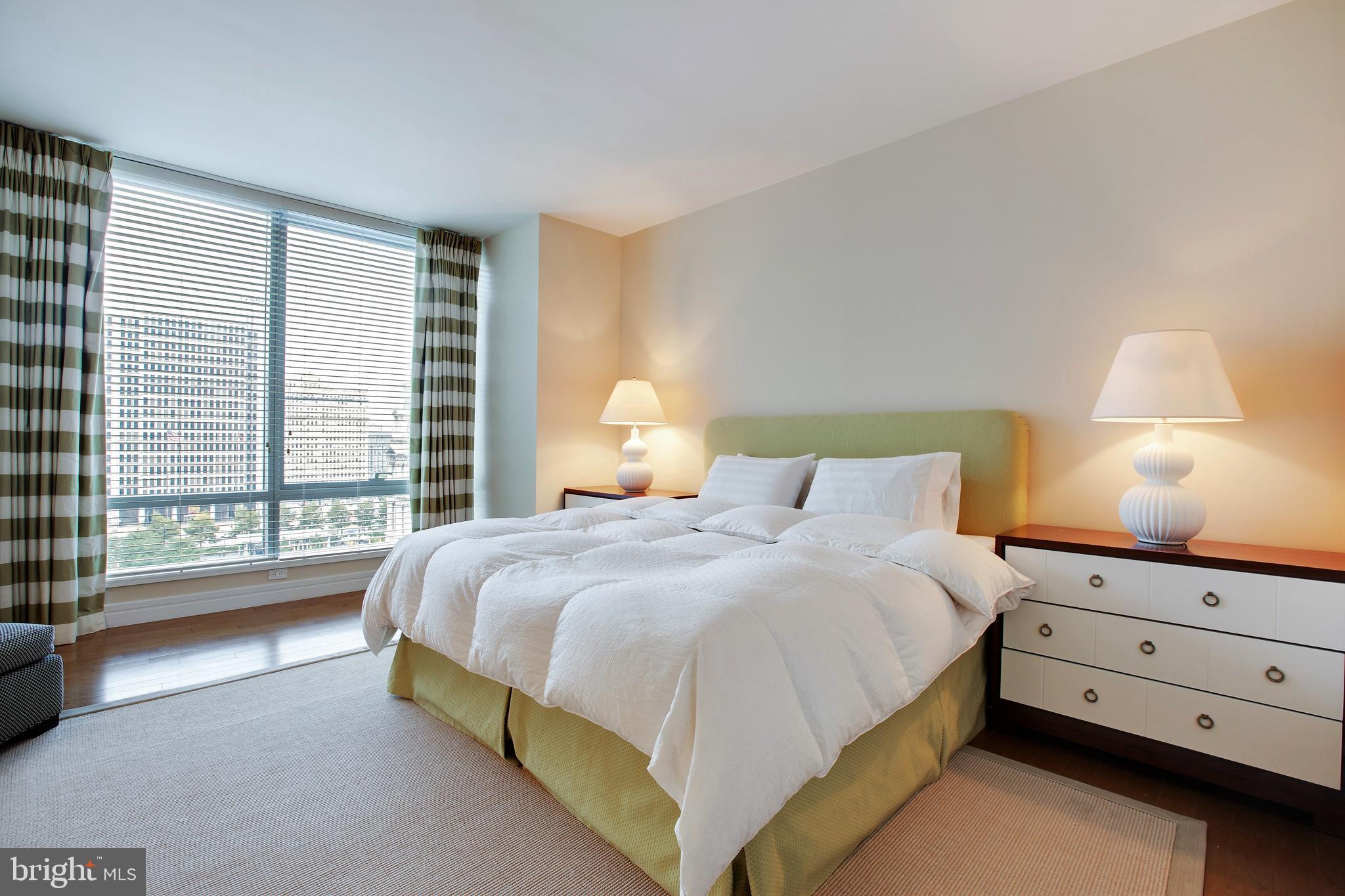 1414 South Penn Square, Unit 10F Philadelphia, PA 19102 - Photo 11 of 34 a bedroom with a bed and a window