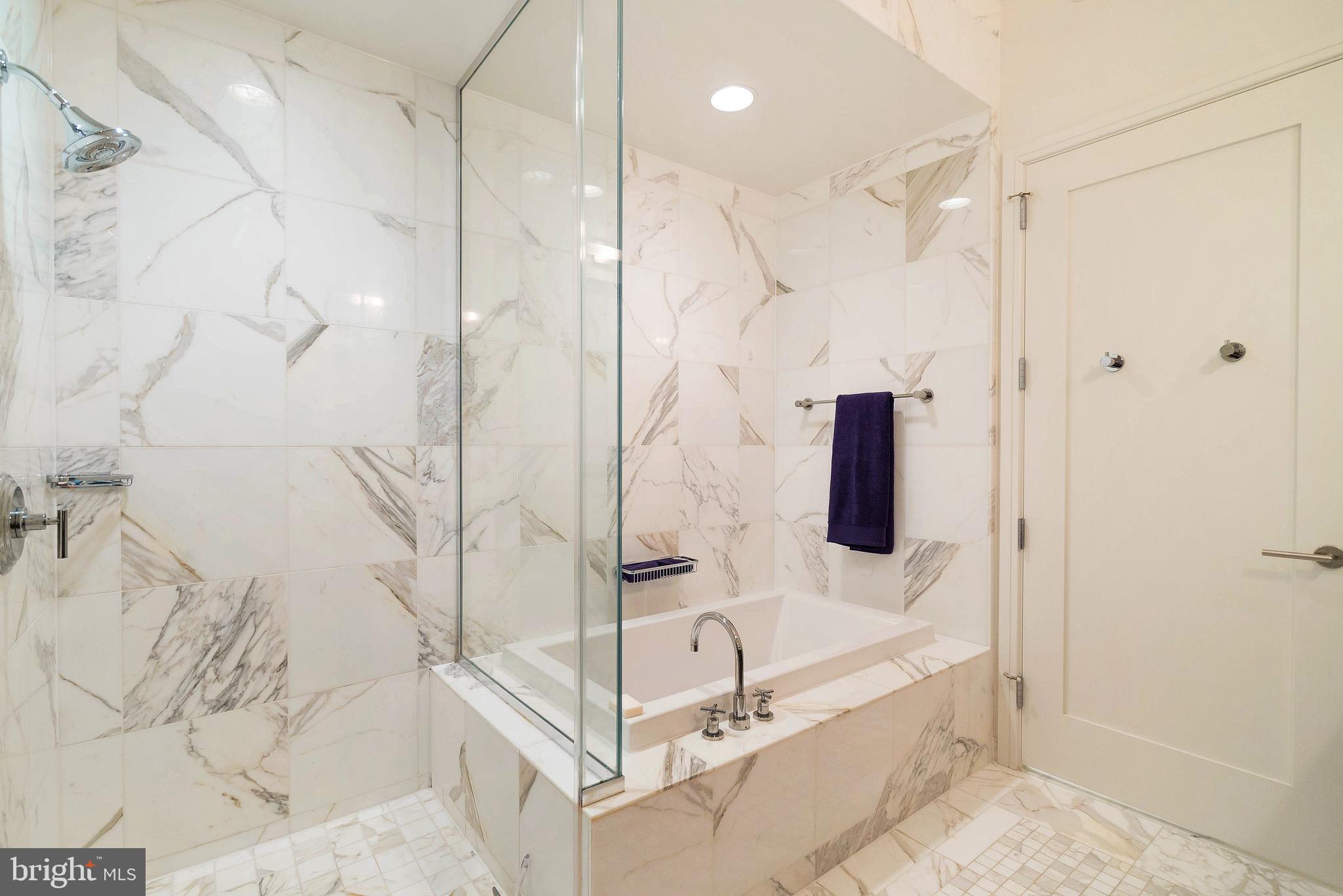 1414 South Penn Square, Unit 10F Philadelphia, PA 19102 - Photo 15 of 34 a bathroom with a bathtub and a shower