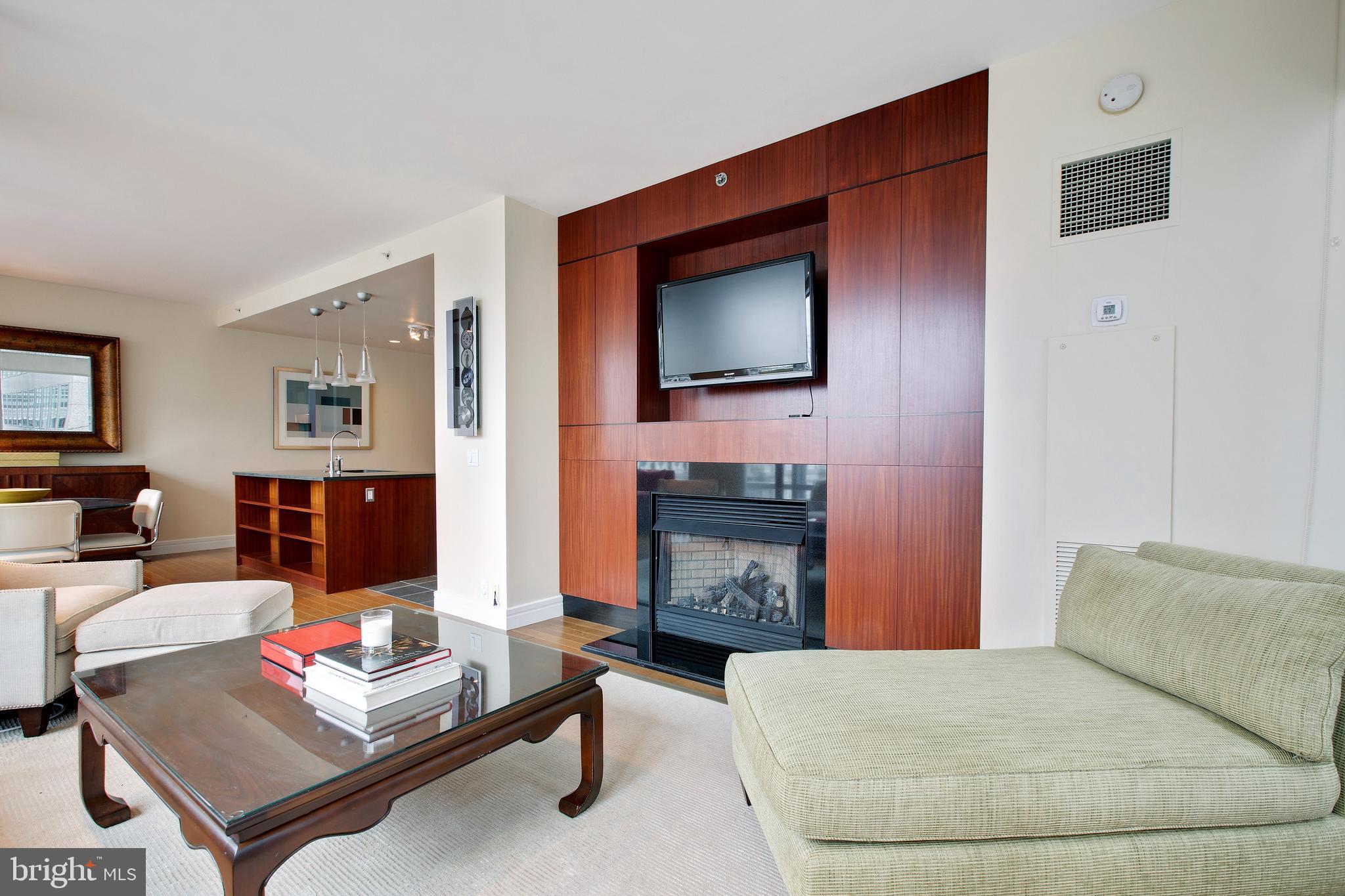 1414 South Penn Square, Unit 10F Philadelphia, PA 19102 - Photo 3 of 34 a living room with furniture fireplace and flat screen tv