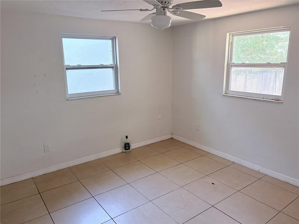 3818 Moog Road Holiday, FL 34691 - Photo 11 of 19 an empty room with a window