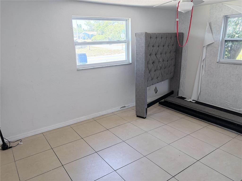 3818 Moog Road Holiday, FL 34691 - Photo 12 of 19 a view of an empty room with a window