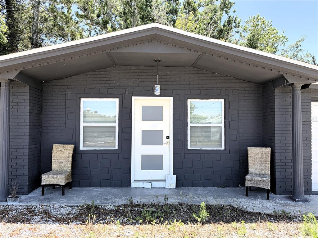 3818 Moog Road Holiday, FL 34691 - Photo 6 of 19 a front view of a house with garden