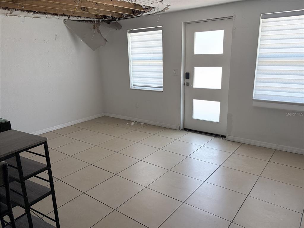3818 Moog Road Holiday, FL 34691 - Photo 7 of 19 an empty room with windows
