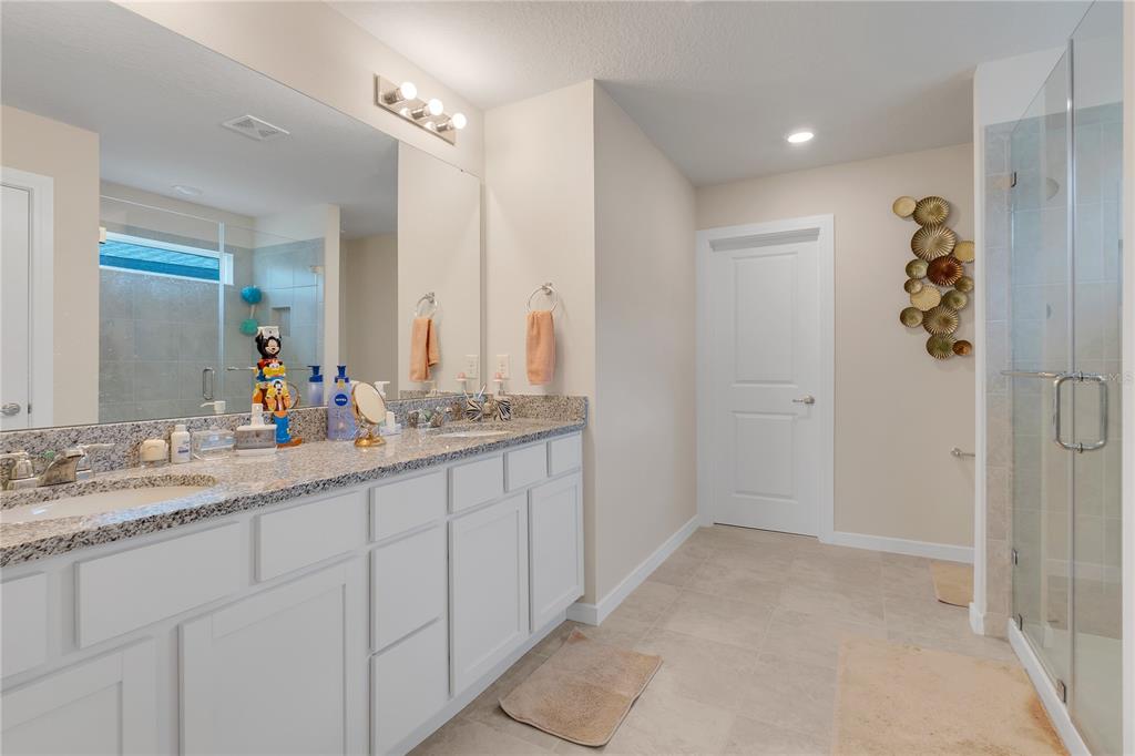 1001 Rivers Crossing Street Clermont, FL 34714 - Photo 18 of 41 a bathroom with a double vanity sink mirror and double