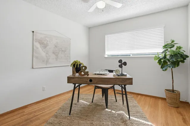 a view of a workspace with furniture
