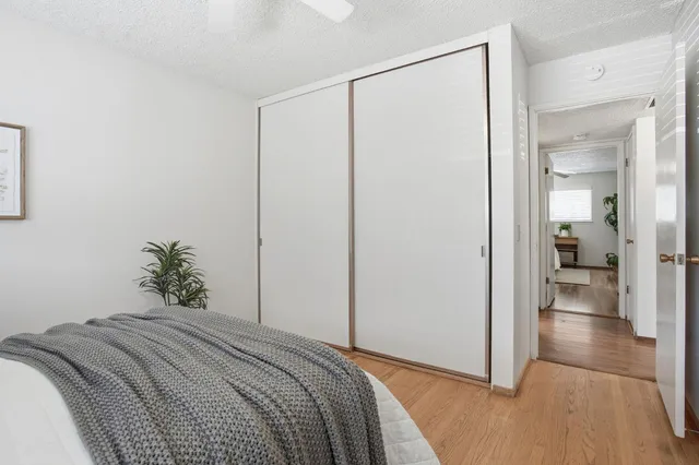 a bedroom with a bed and hallway