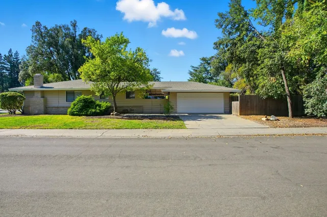 a house with trees in the background