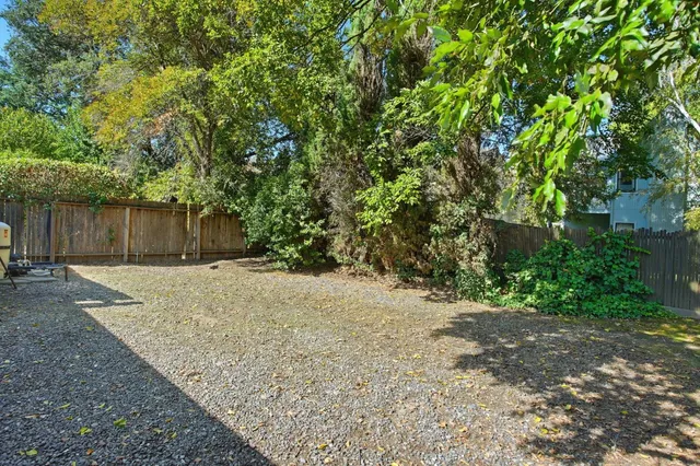 a backyard of a house with lots of green space