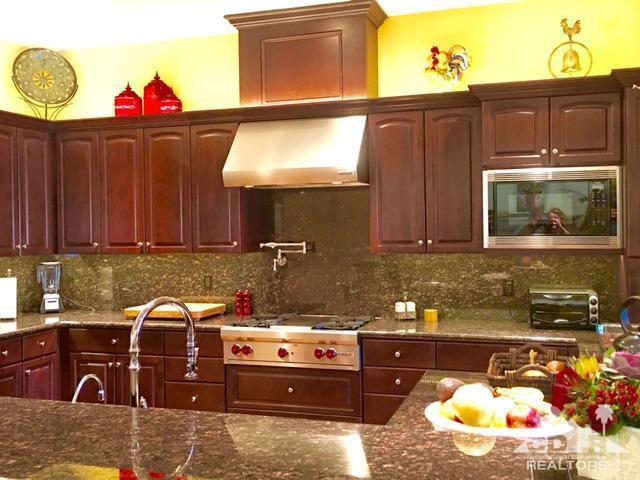 40278 Rancho Palmeras Rancho Mirage, CA 92270 - Photo 13 of 68 a kitchen with a stove a sink and a microwave