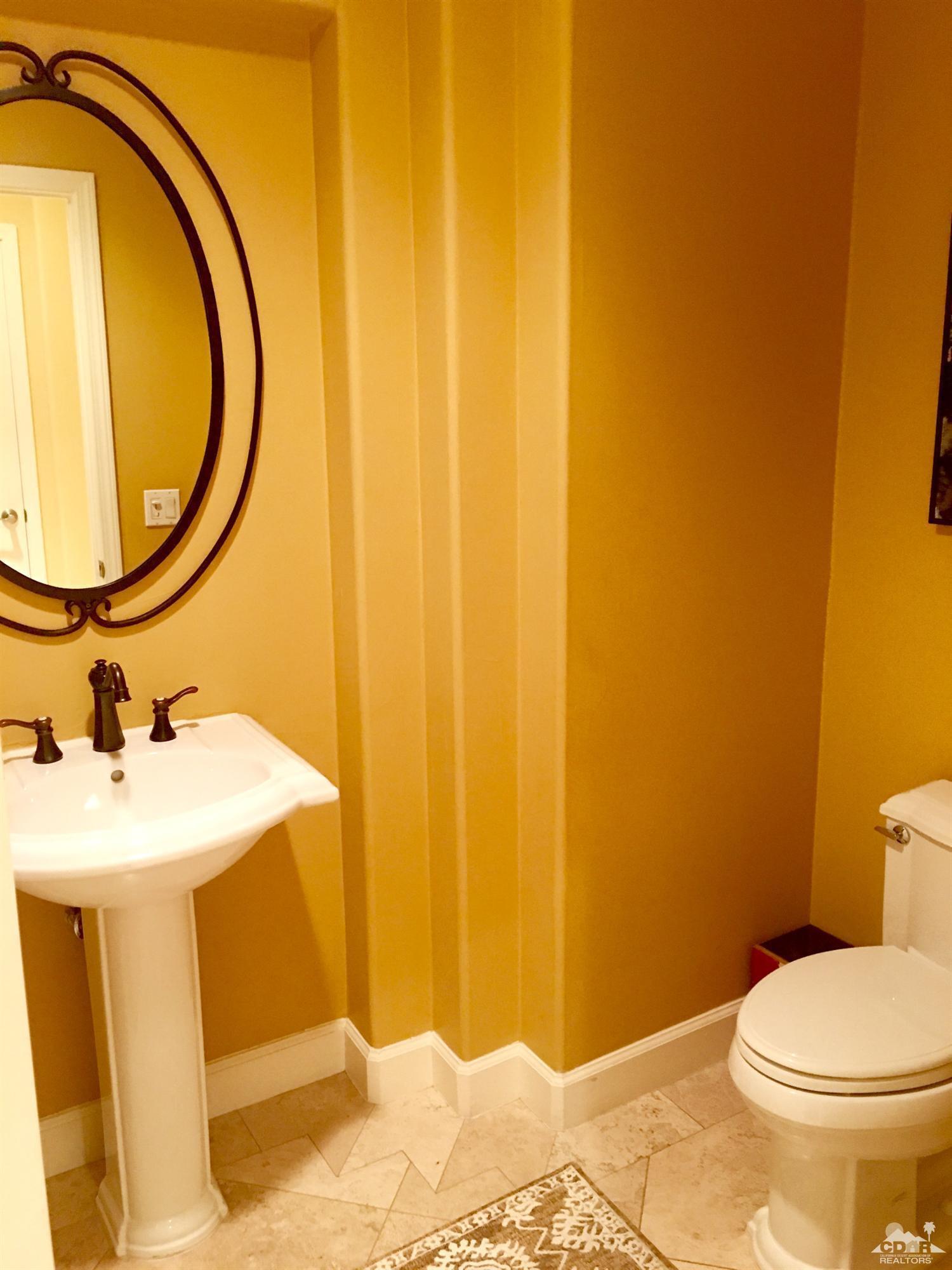 40278 Rancho Palmeras Rancho Mirage, CA 92270 - Photo 29 of 68 a bathroom with a sink and a mirror