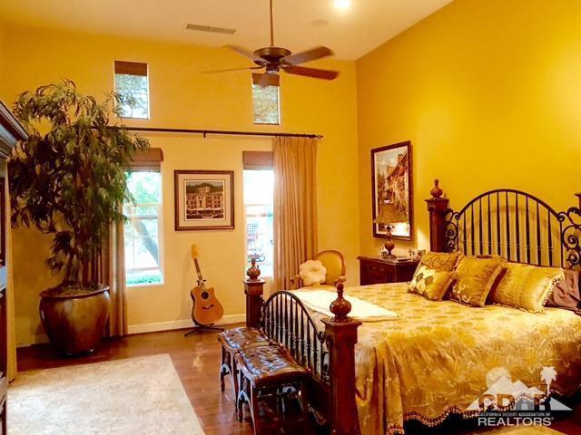 40278 Rancho Palmeras Rancho Mirage, CA 92270 - Photo 31 of 68 a bed room with a bed and a chair