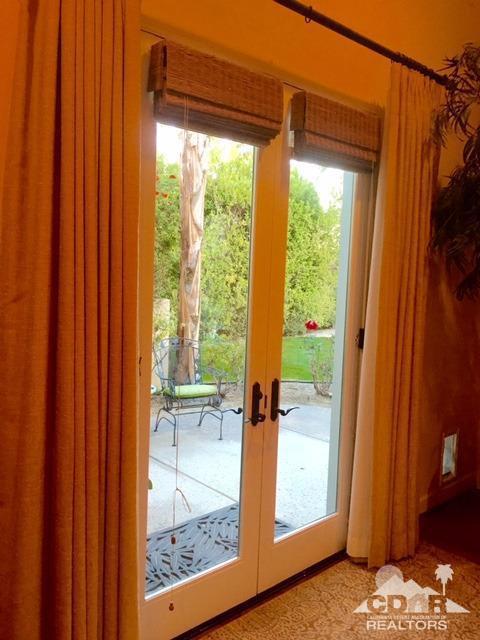 40278 Rancho Palmeras Rancho Mirage, CA 92270 - Photo 32 of 68 a view of a porch with furniture and front door