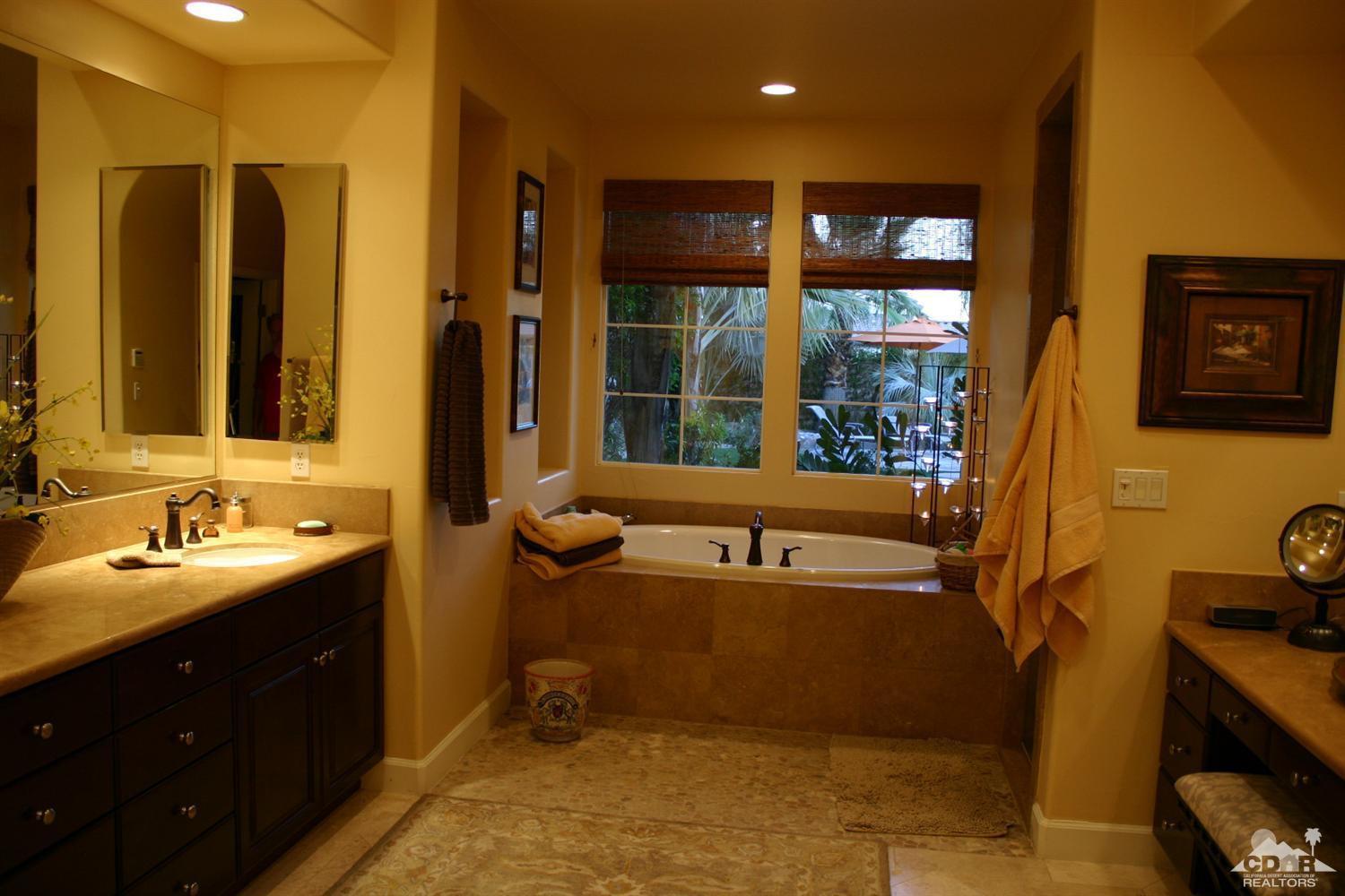 40278 Rancho Palmeras Rancho Mirage, CA 92270 - Photo 34 of 68 a bathroom with a tub sink and mirror