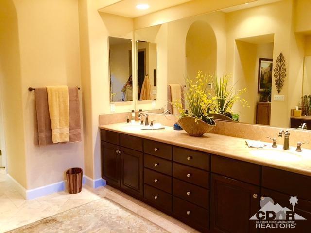 40278 Rancho Palmeras Rancho Mirage, CA 92270 - Photo 36 of 68 a bathroom with a double vanity sink and a mirror