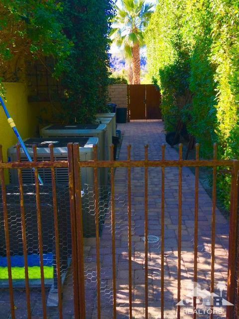 40278 Rancho Palmeras Rancho Mirage, CA 92270 - Photo 38 of 68 a view of a house with a tree and a yard