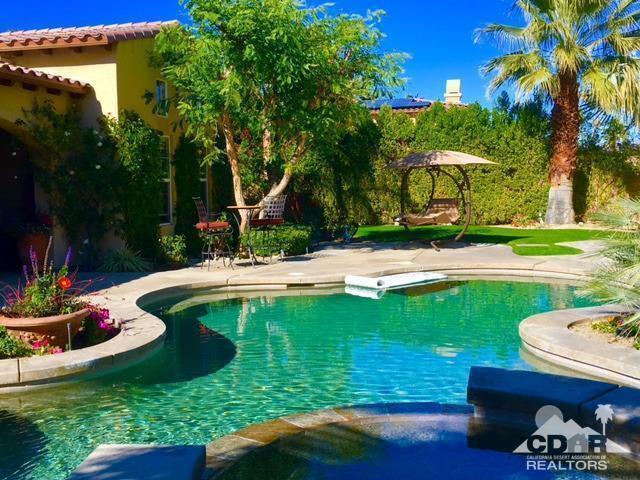 40278 Rancho Palmeras Rancho Mirage, CA 92270 - Photo 39 of 68 a view of a garden with a fountain