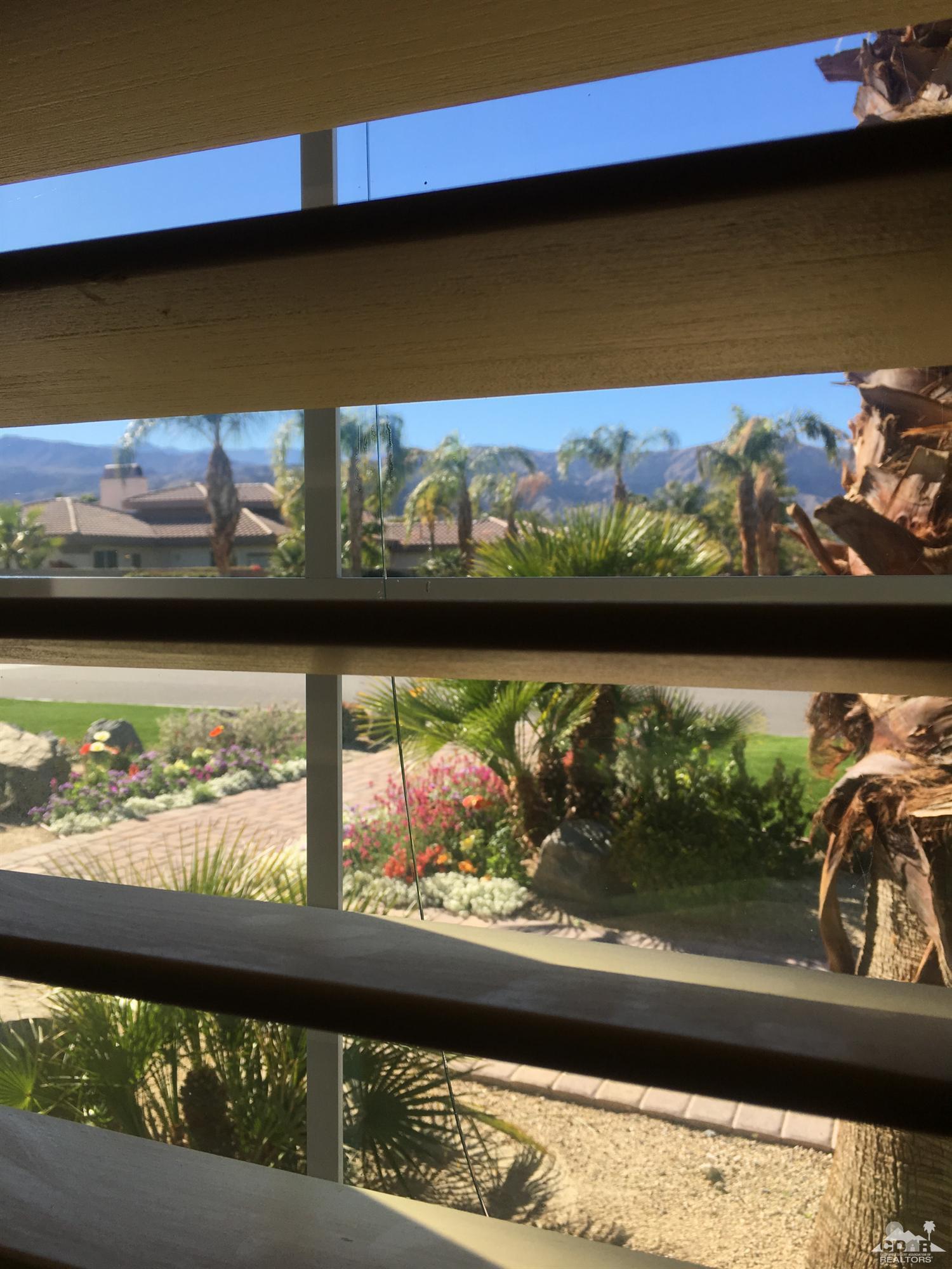 40278 Rancho Palmeras Rancho Mirage, CA 92270 - Photo 44 of 68 a view of a lake from a window