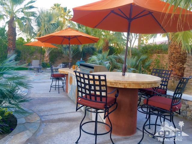 40278 Rancho Palmeras Rancho Mirage, CA 92270 - Photo 48 of 68 a view of a patio with furniture and table under an umbrella