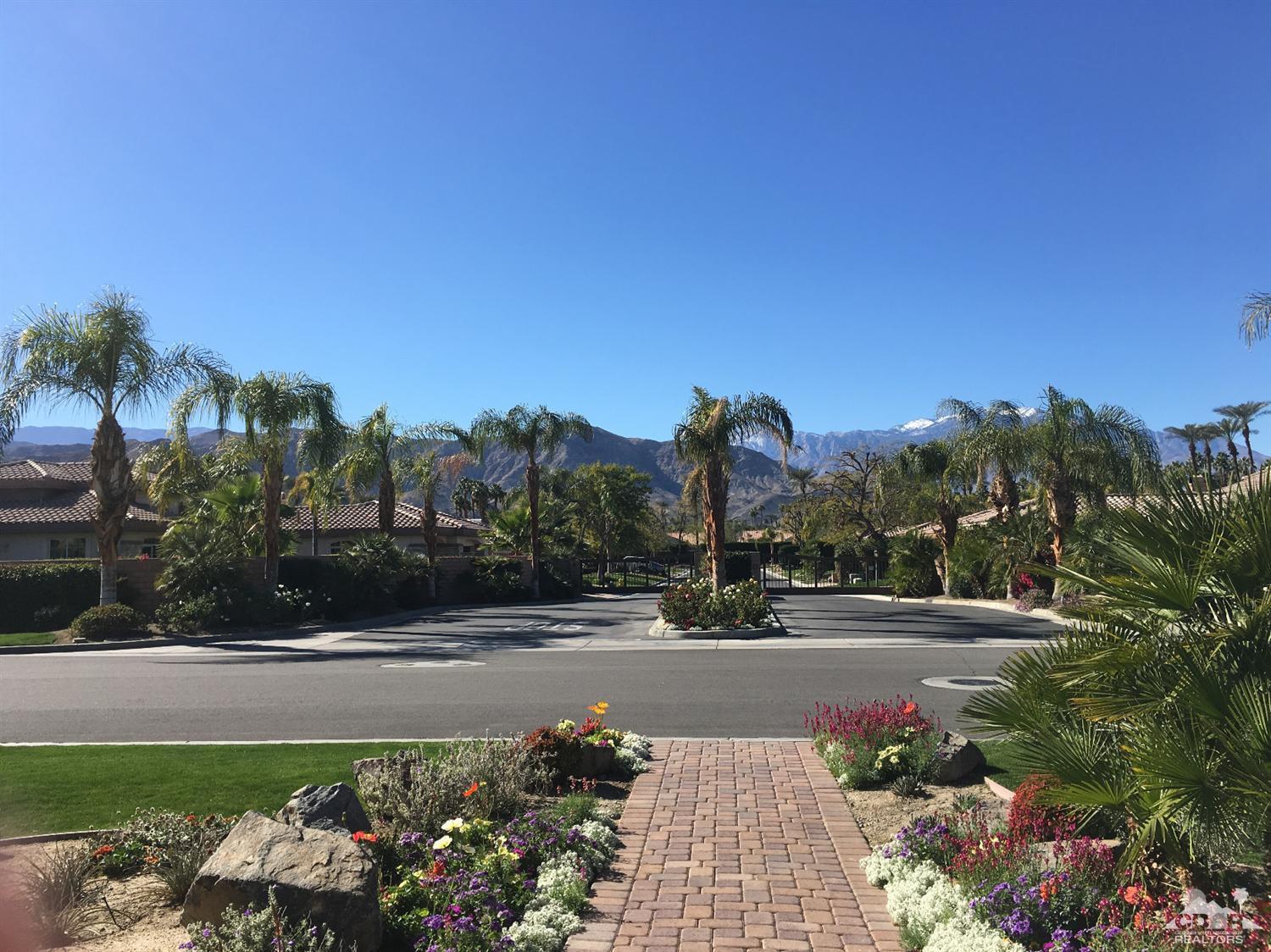 40278 Rancho Palmeras Rancho Mirage, CA 92270 - Photo 61 of 68 a view of a street with flower plants and wooden fence