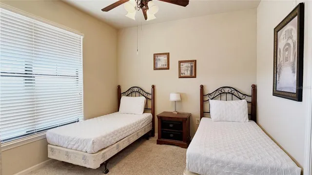 a bedroom with bed and a window