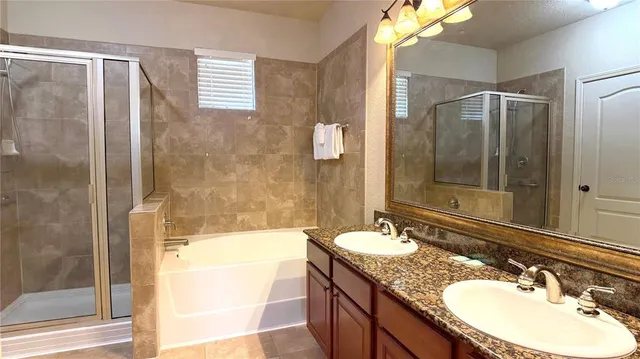 a bathroom with a sink double vanity and a mirror