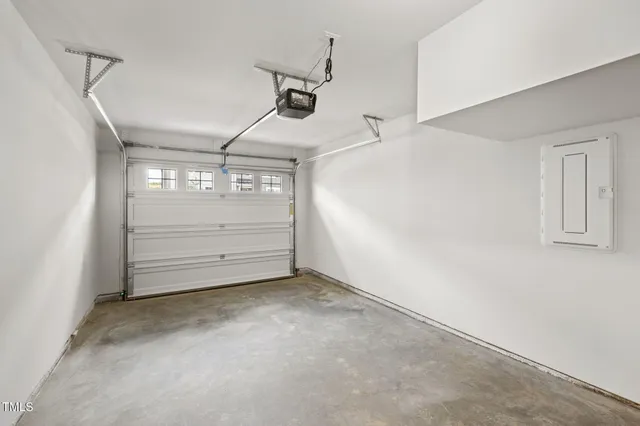 a kitchen with kitchen island a stove a sink a center island and wooden floor